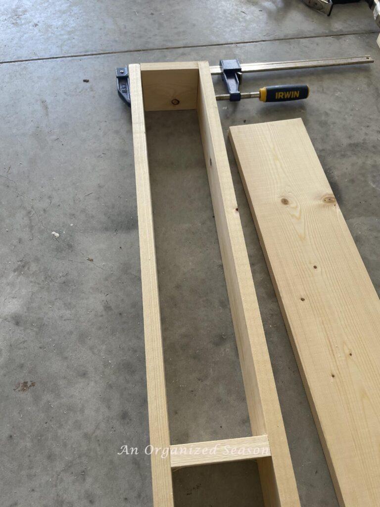 One by four side boards and braces assembled with a clamp