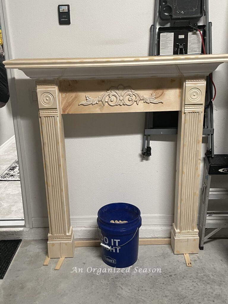 fully constructed faux fireplace mantel ready to be painted