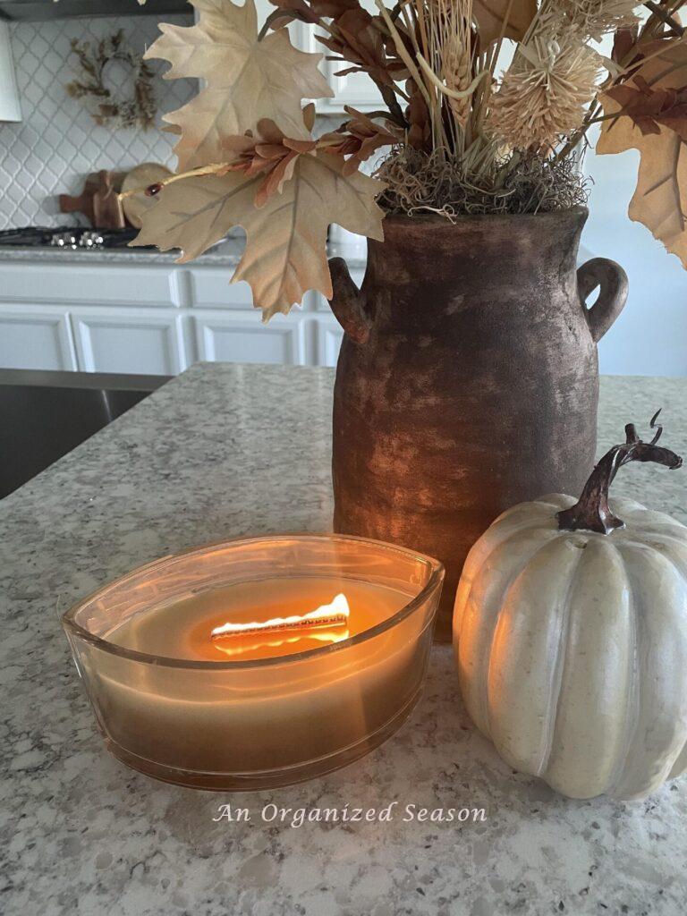 Our # 2 Fall decor idea is to burn a fall scented candle in your kitchen.