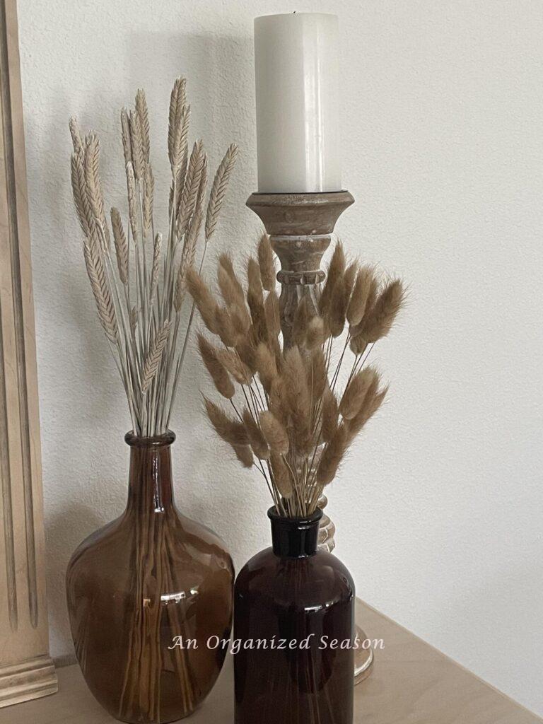 Brown amber bottles filled with neutral dried botanicals. 