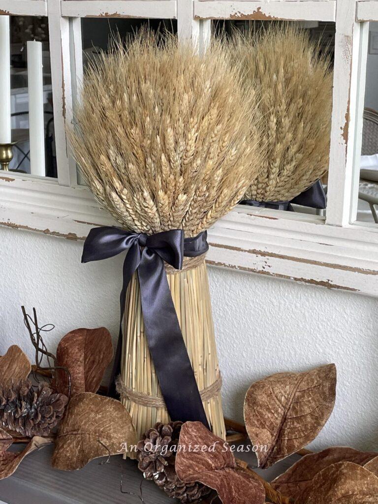 A dried wheat arrangement tied with a brown bow!