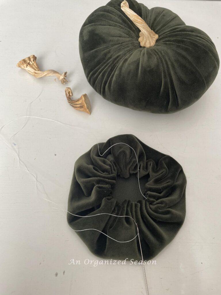 Step three to make DIY velvet pumpkins is to pull your thread tight to make a pouch. 