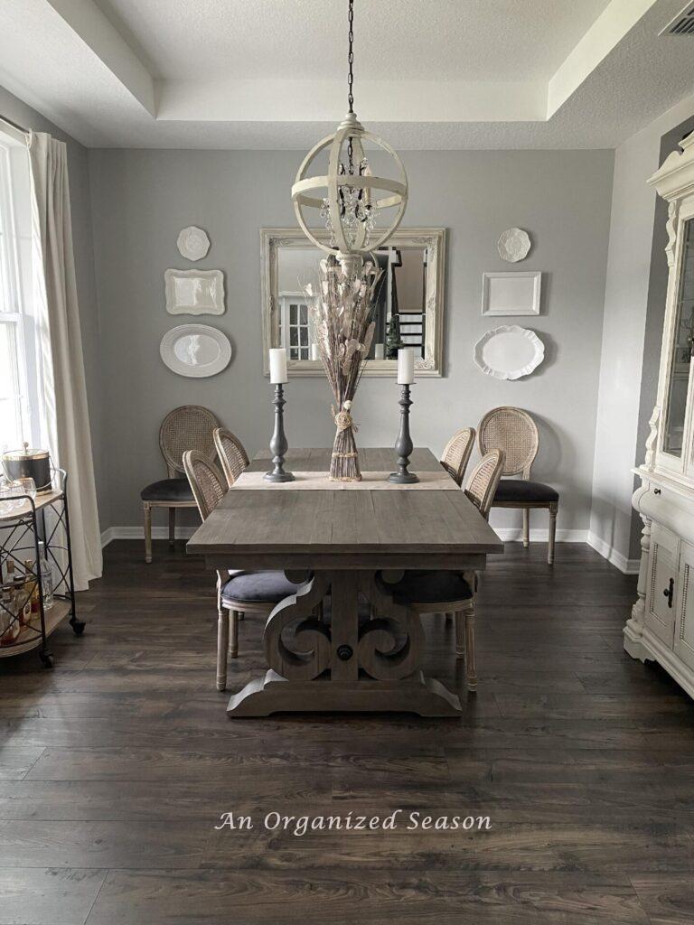 A dining room with a gray table.