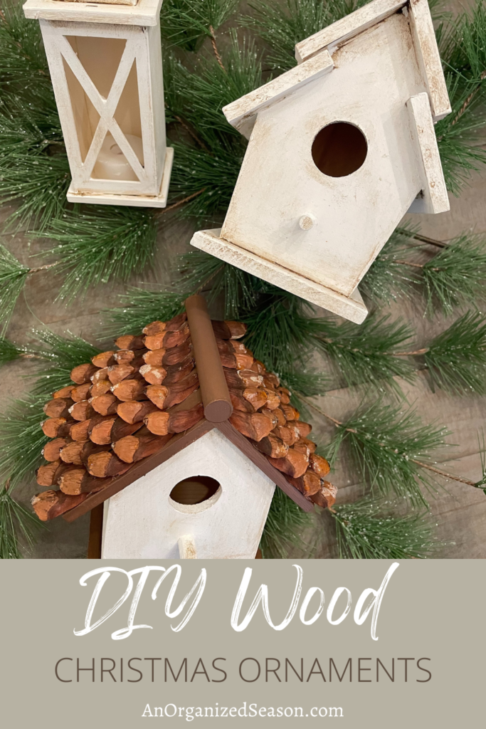 Two birdhouses and a lantern made into Christmas ornaments