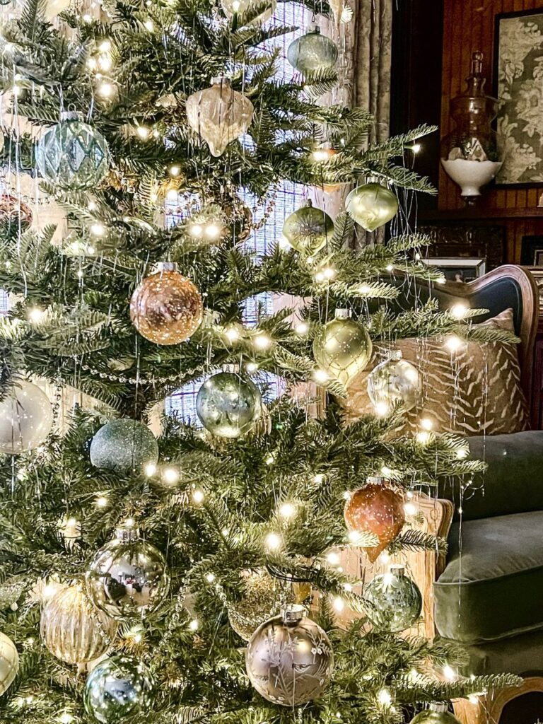 A Christmas tree decorated with vintage ornaments. 