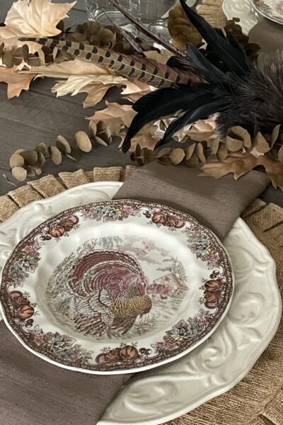 Turkey salad plate on a cream dinner plate and a burlap ruffled placemat.