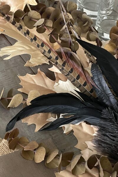 Tan leaves, brown eucalyptus, and bird feathers