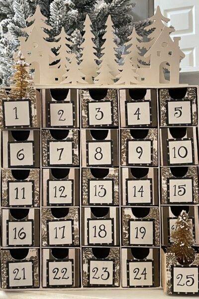 DIY Advent Calendar with 25 boxes and wood trees on top.