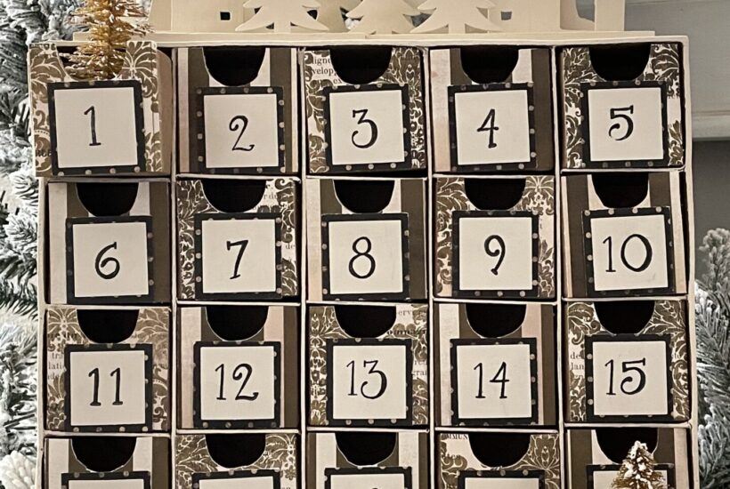 DIY Advent Calendar with 25 boxes and wood trees on top.