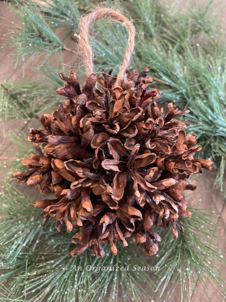 A Christmas ornament made with the tips of pinecones. 