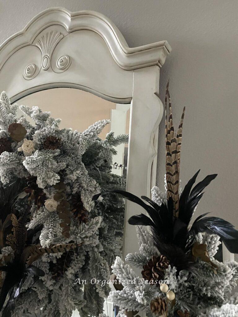 A tree topper made of pheasant and rooster feathers. 