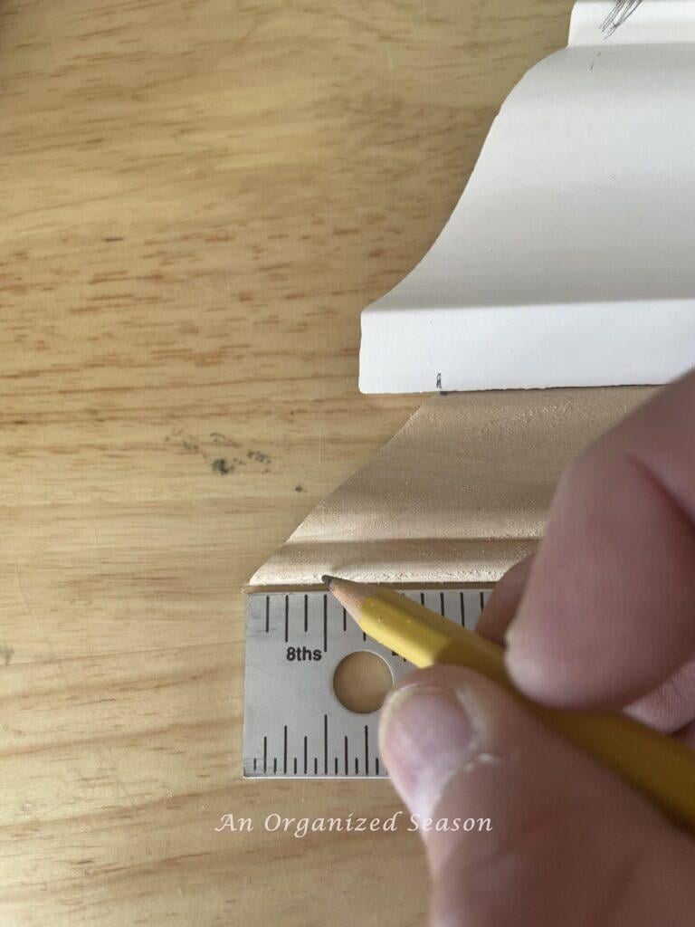 Step two to make a wooden Christmas tree s to measure and mark the wood at 1/2 inch.