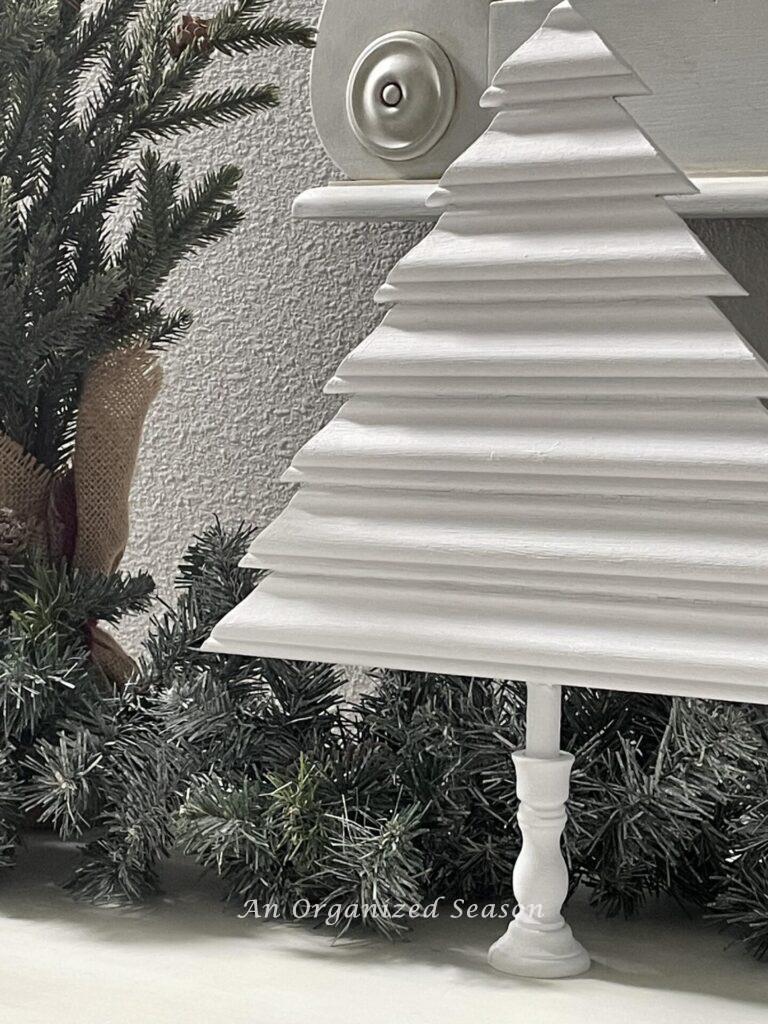 A white Christmas tree made with wood trim scraps. 