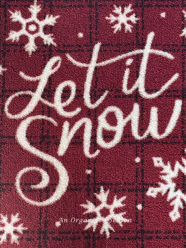 Rug that says, "Let it snow" makes perfect Christmas porch decor. 