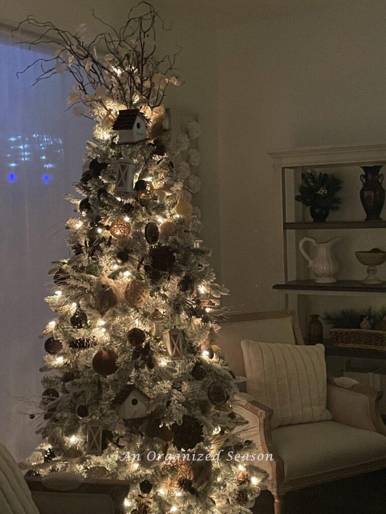 A woodland themed Christmas tree with white lights. 