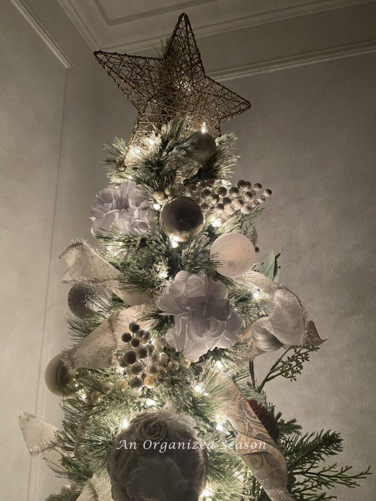 The top half of a decorated Christmas  tree with a star topper! 