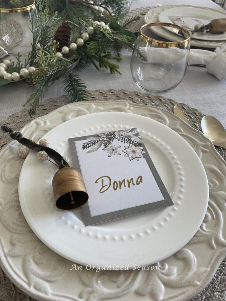 A cream dinner plate with a white salad plate make pretty neutral Christmas decor.