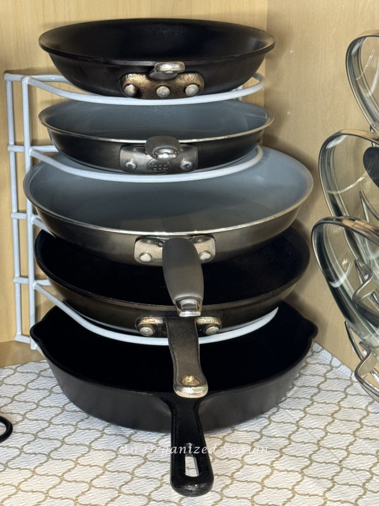 Use a vertical rack to organize pans and pots. 