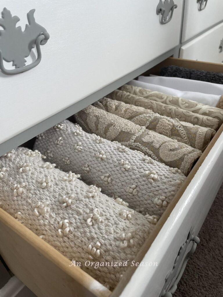 Pillow covers that were organized in a drawer during the home organization challenge. 