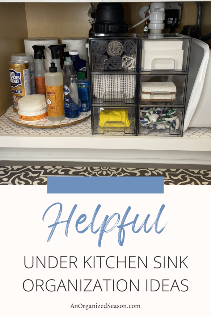 Organized clear drawers and lazy Susan under kitchen sink