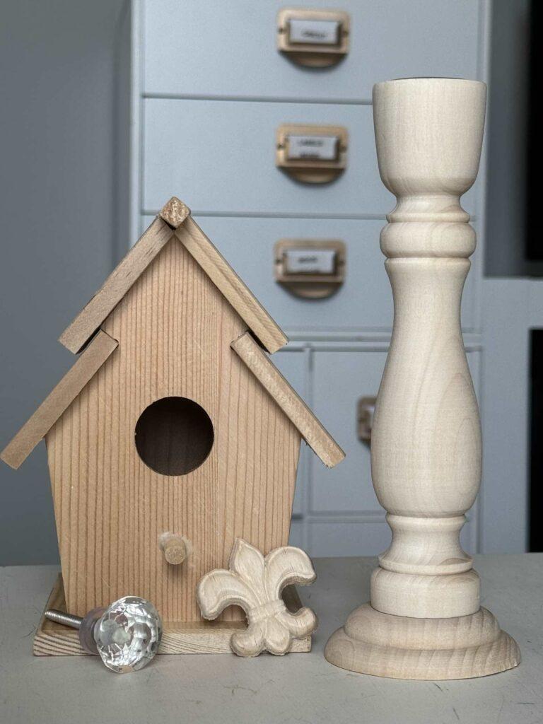 Wood birdhouse, candlestick, applique, and glass knob we'll DIY for Spring decor. 