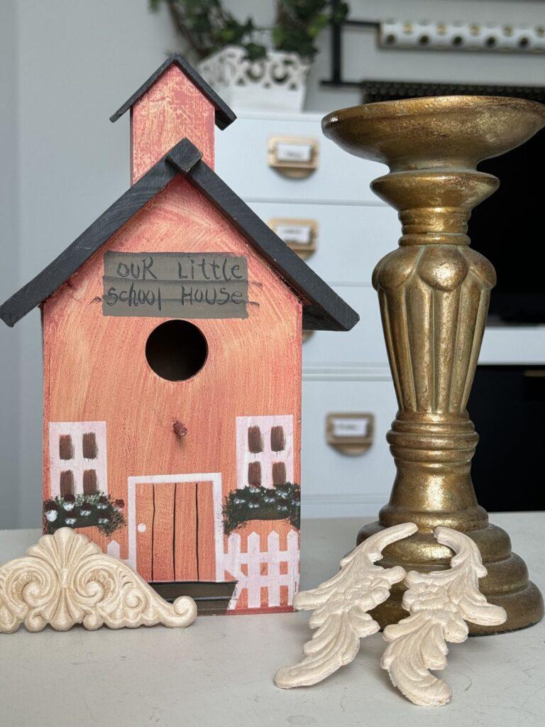 Birdhouse, candlestick, and wood appliques.