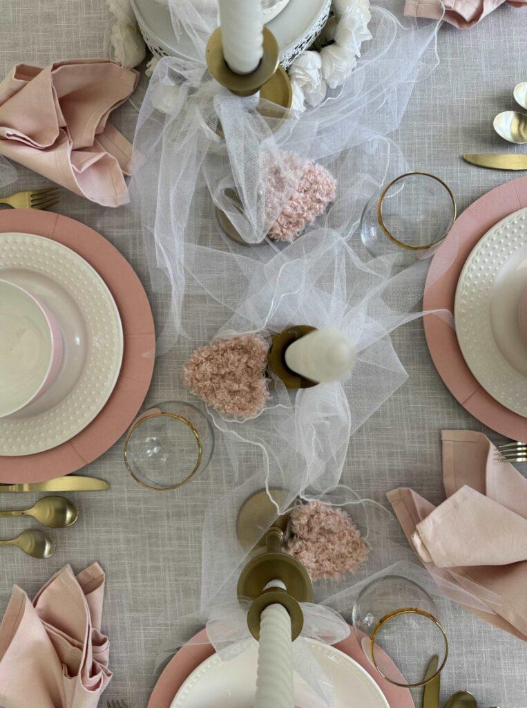 Fluffy pink hearts on a dining room table. 