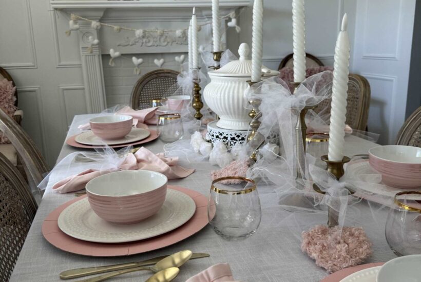 A white dining room decorated with ink for Valentine's Day.