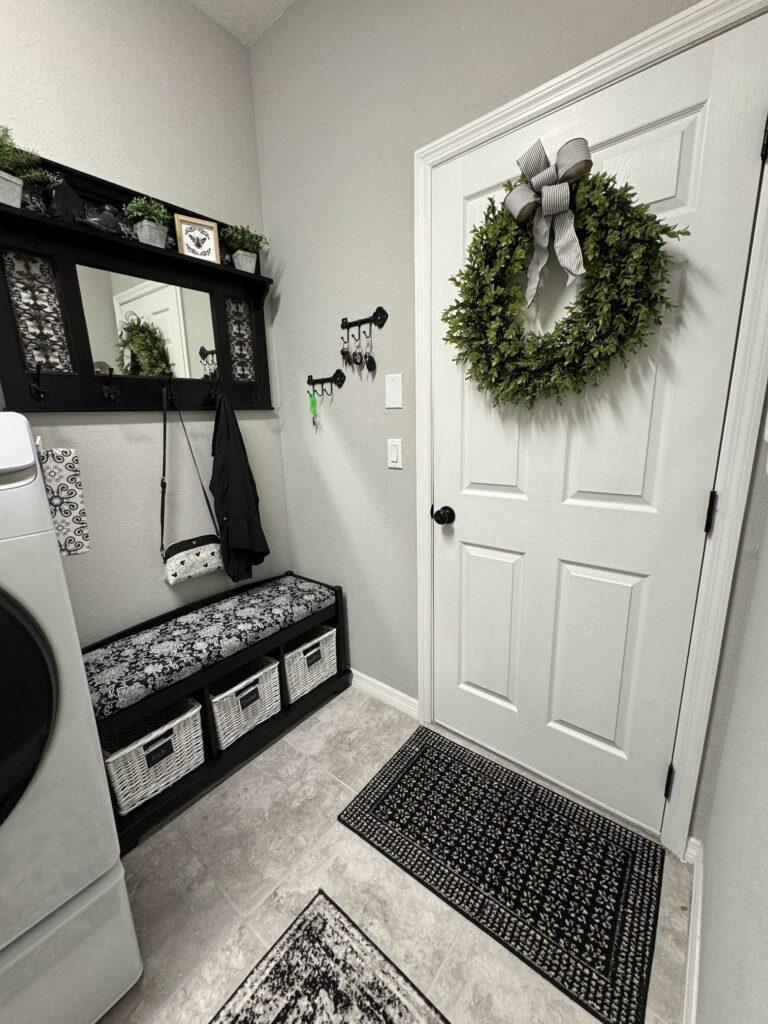 An organized drop zone in a laundry room. 