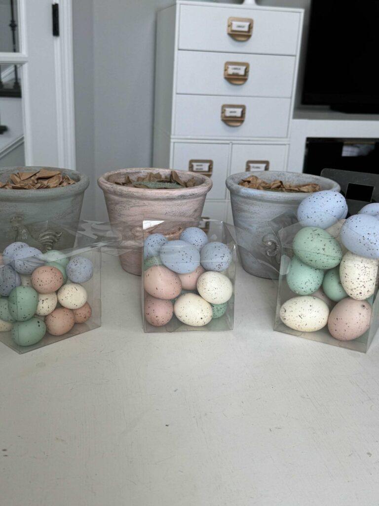 Step three to make an Easter egg topiary is to organize eggs by size.