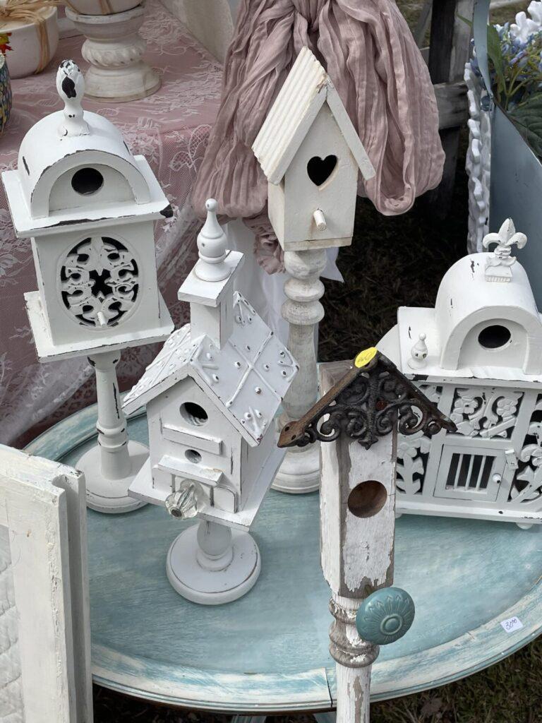 Four pedestal birdhouses for sale that are perfect for Spring decor. 