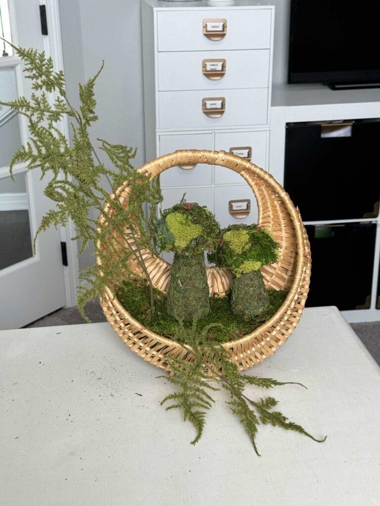 A basket with moss mushrooms and fern stems. 