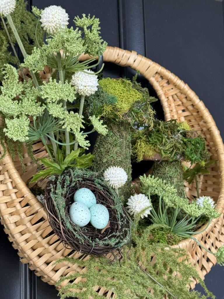 A Spring wreath hanging on a front door. 