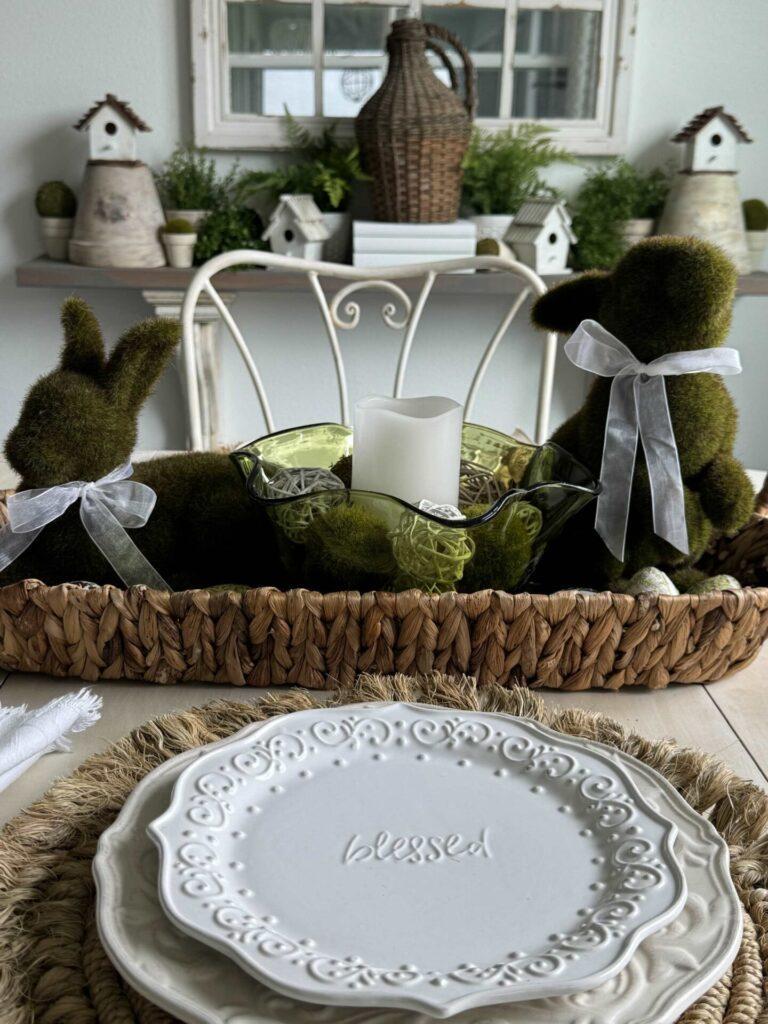 Two moss bunnies in a basket with a scalloped bowl holding a candle makes a nice Spring decor idea. 