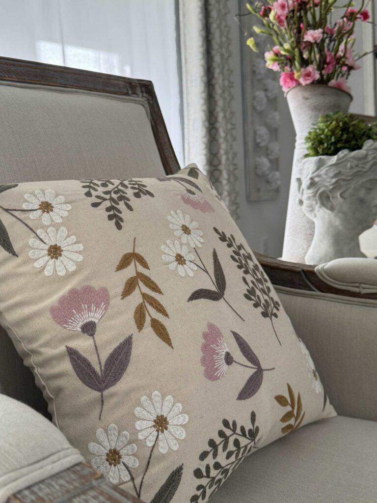 An easy Spring decor idea is to use a floral embroidered pillow. 