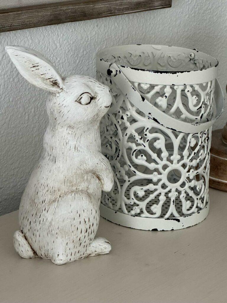 A bunny statue next to a wire basket makes for an easy Spring decor idea. 