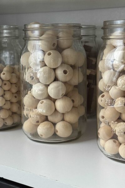 Wood beads stored in mason jars