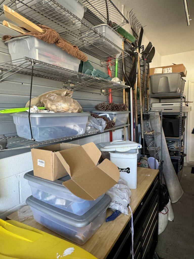 Disorganized garage that is part of the Spring Home Organization Challenge. 