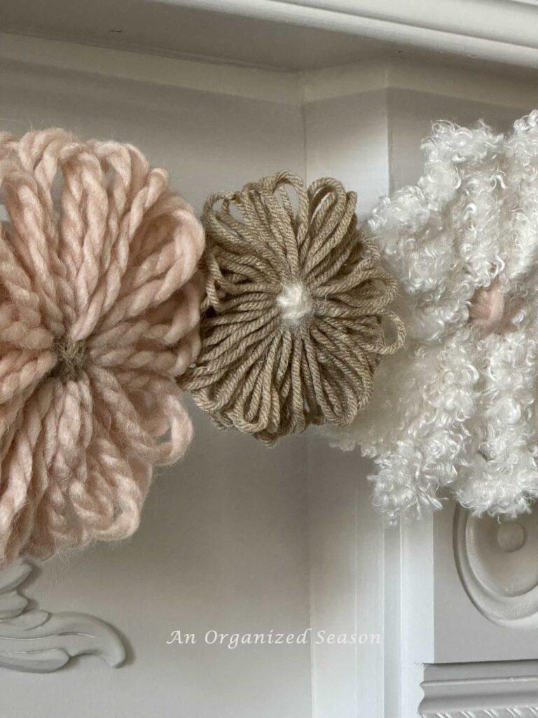 Three yarn flowers.