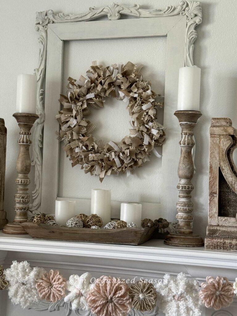 A white fireplace decorated for Mother's Day.  