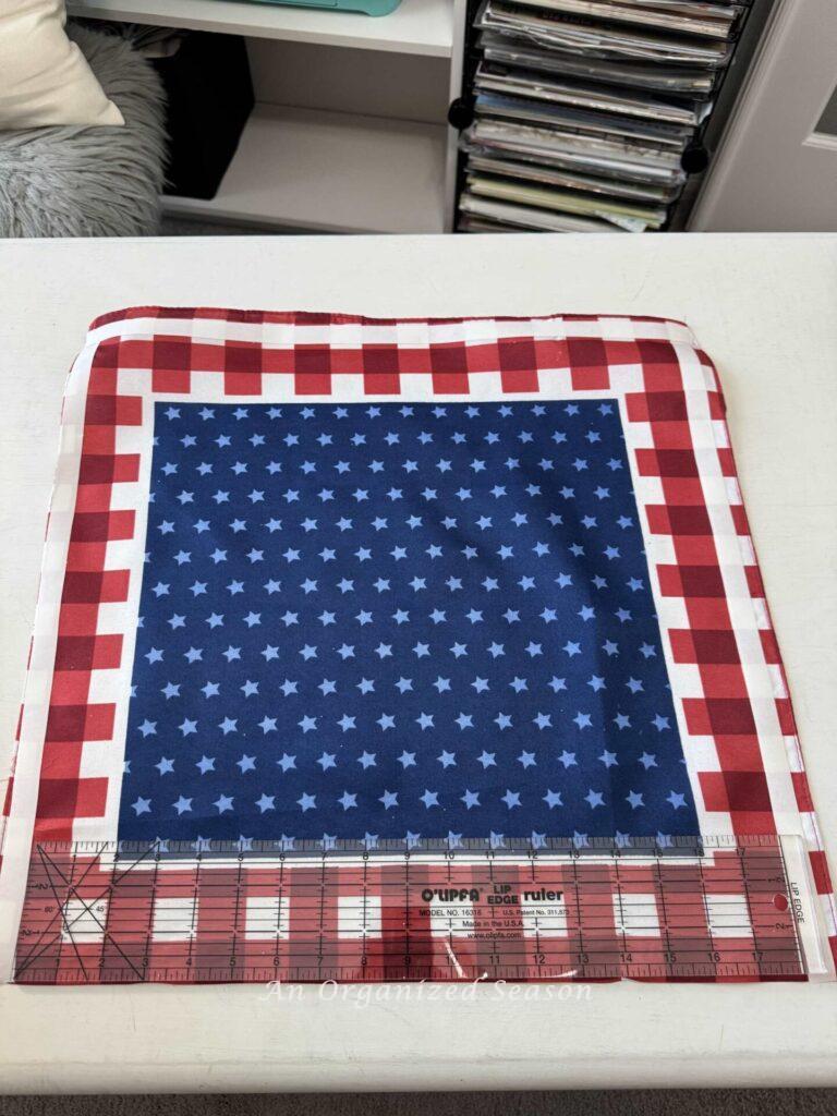 A flag bandana with fuse tape on three sides of it. 