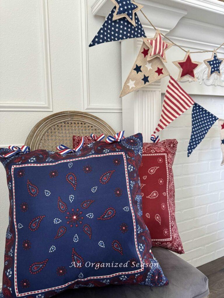 Red and Blue bandana pillows sitting on a chair. 
