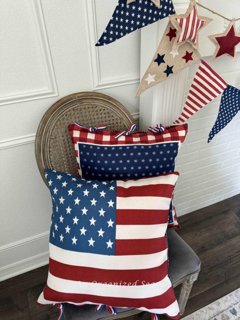 DIY patriotic flag pillows sitting on a chair. 