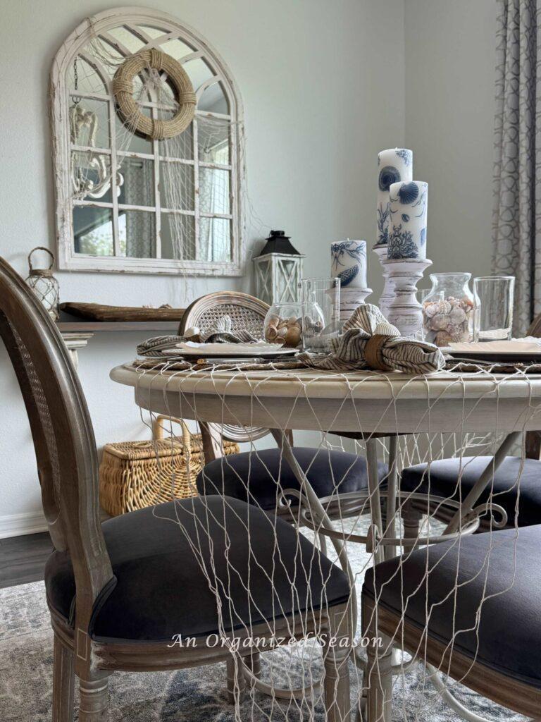 A fishing net draped over a dining table makes the perfect coastal table decor.