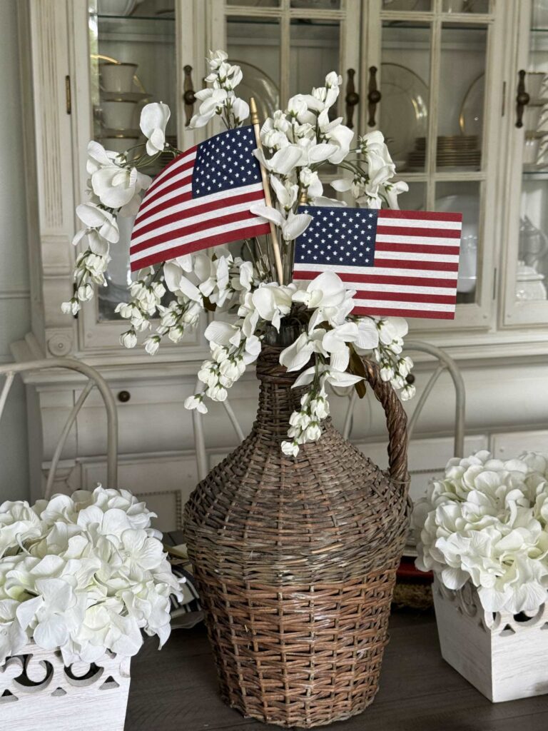 Add American flags to a centerpiece to add patriotic table decor.