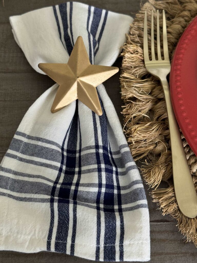 Use blue and white cloth napkins and a star napkin holder to add patriotic table decor.