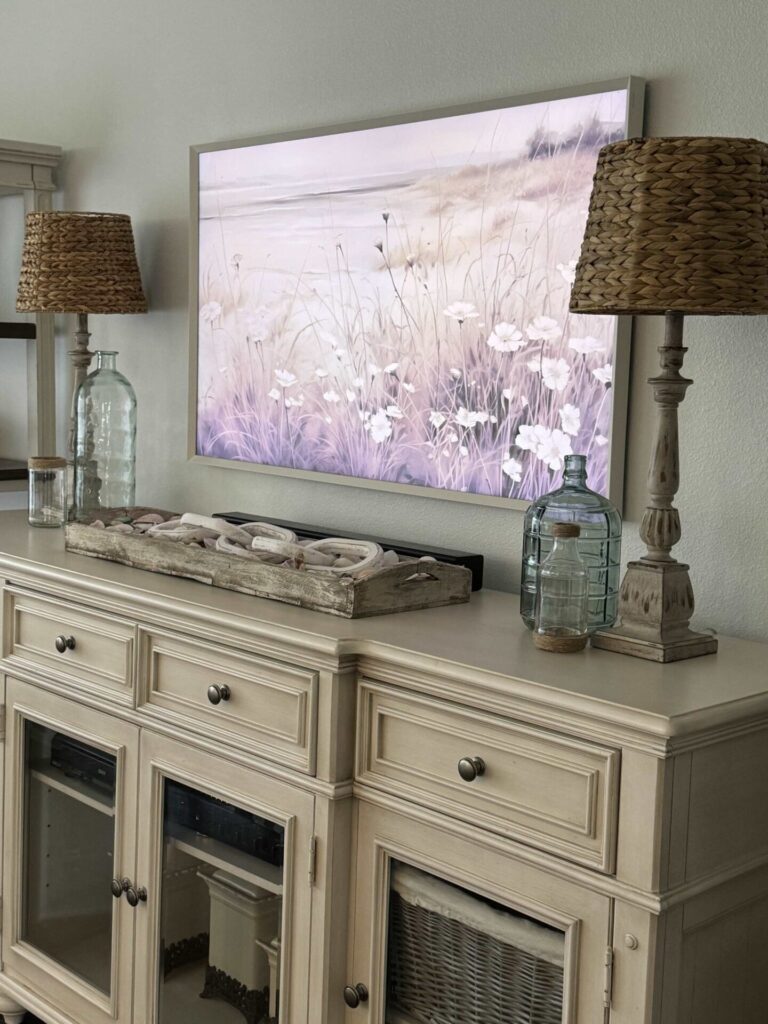 TV console table with two lamps with rattan shades. 