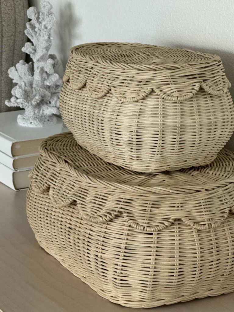 Two stacked baskets with scalloped lids. 