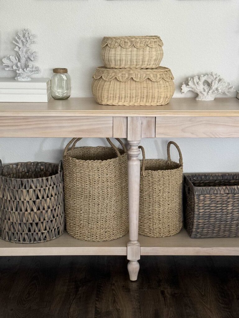 A collection of baskets on a console table. 