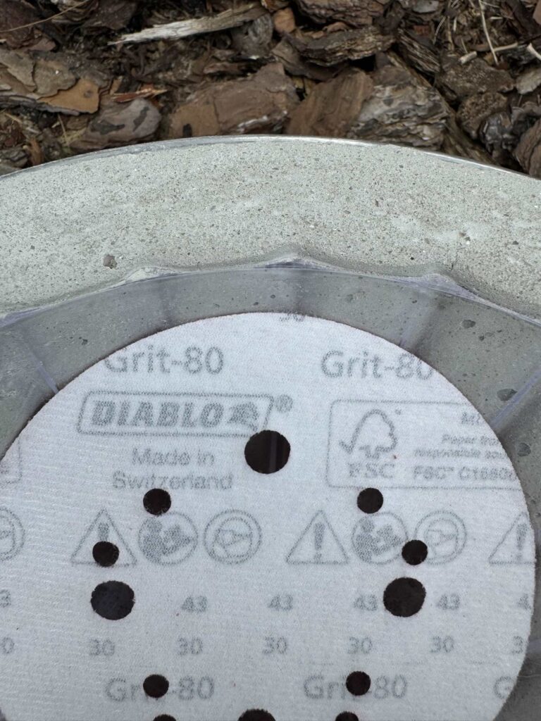 An 80 grit sand paper disc. 